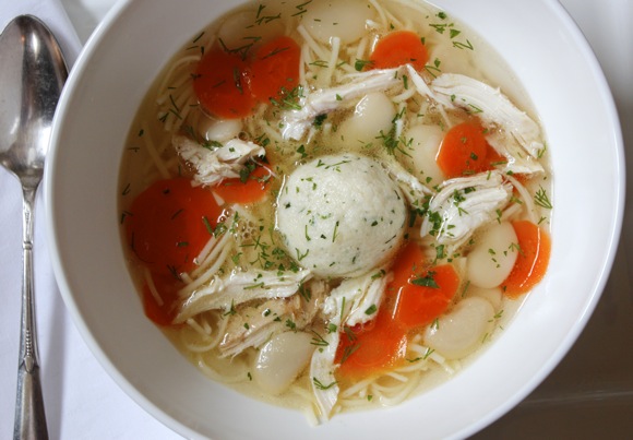 chicken soup with matzoh ball, noodles, carrots