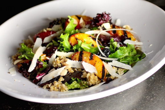 Grilled Nectarine Salad with Freekeh, Mixed Greens, Marcona Almonds, Parmesan, Fried Kalamata Olive Balsamic Reduction