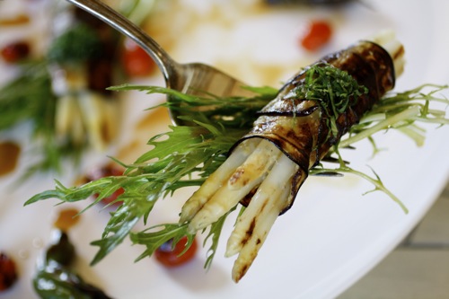 white asparagus wrapped in eggplant