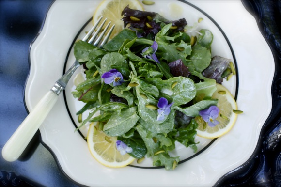 Baby Lettuce and Mache Salad with Meyer Lemon Wheels, Slivered Pistachios, Violas