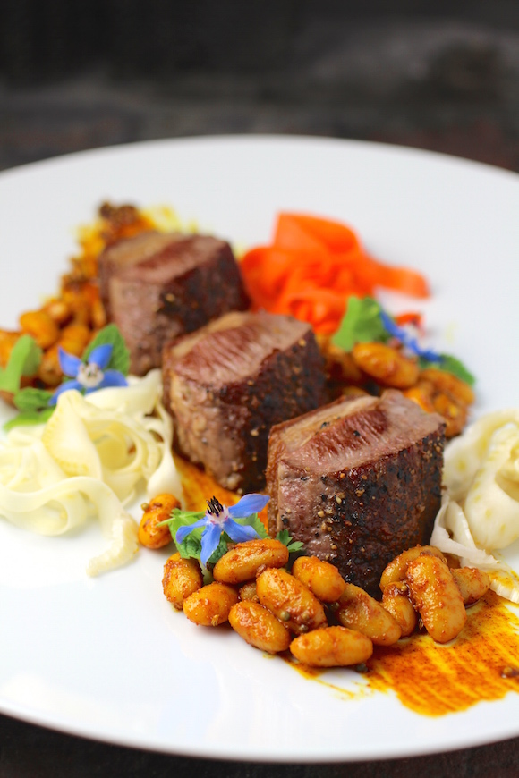Silere Merino Lamb Loin Fillets Mustard Seed Sauce, Cannellini Beans Pickled Fennel, Carrot, Parsnip Cilantro, Mint, Borage