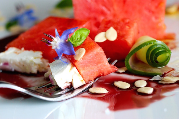 Watermelon Salad - Pomegranate Syrup, Feta, Cucumber, Red Onion, Borage, Cayenne, Olive Oil, Sprouted Watermelon Seeds, Basil