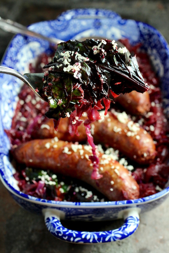 Bratwurst Braised in Beer with Beet Greens and Red Cabbage, Fresh Horseradish