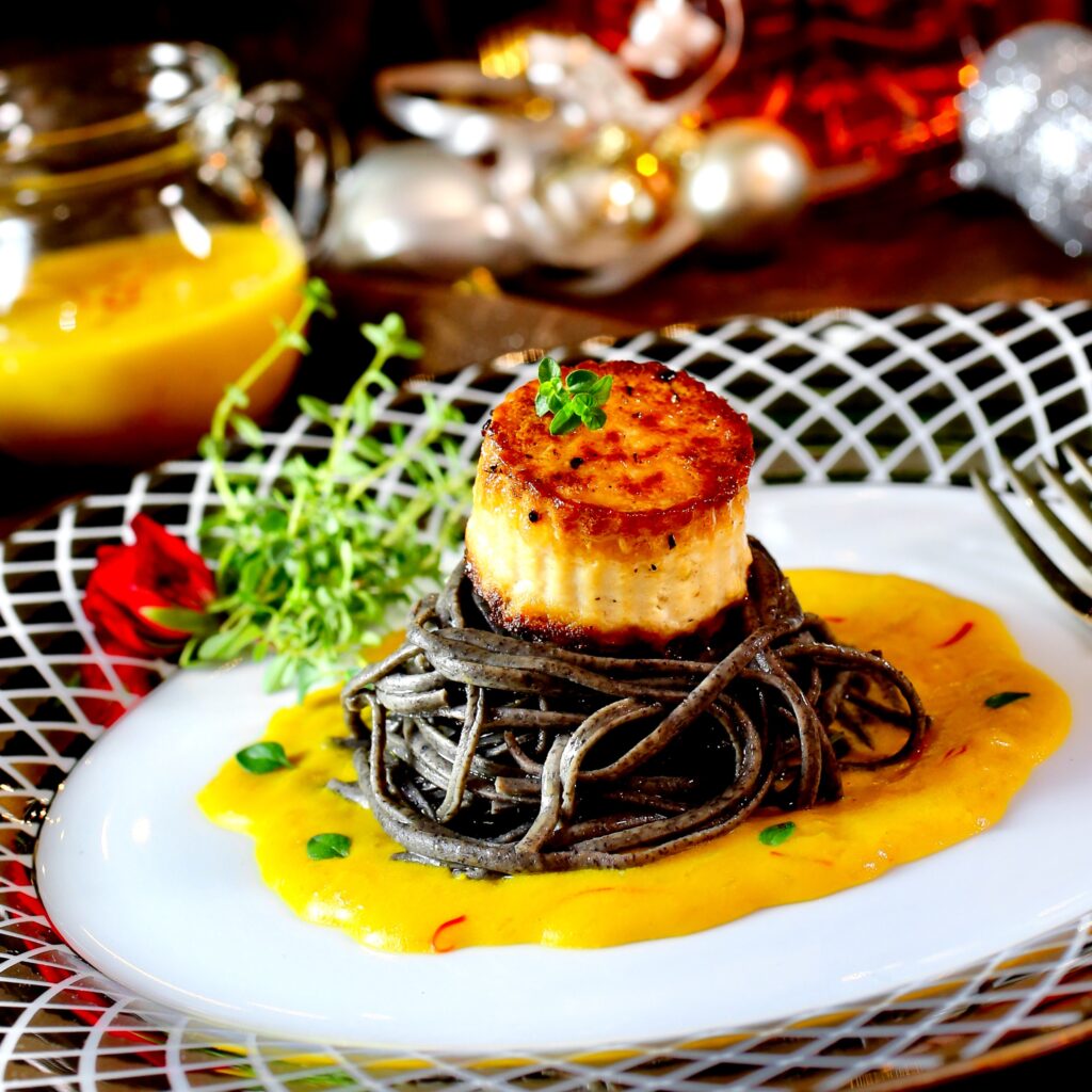Tofu “Scallop” with Black Bean Spaghetti & Saffron “Cream”